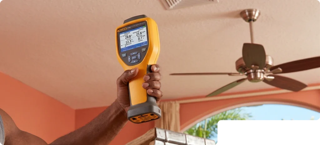 Technician Using Thermal Imaging Camera For Home Inspection At Southwest Florida