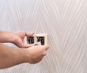 Electrician Installing Double Electrical Outlet In Southwest Florida